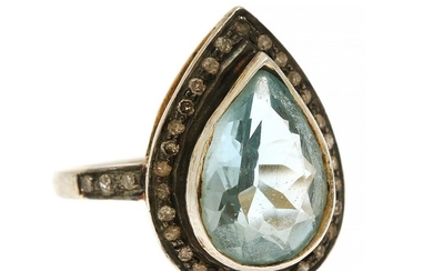 Jewels CPH: A topaz and diamond ring set with a pear-shaped topaz encircled by numerous sinlge-cut diamonds, mounted in sterling silver. Size 52.