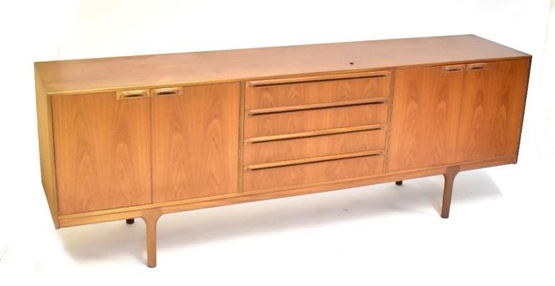 MCINTOSH & CO; a teak sideboard with four central...
