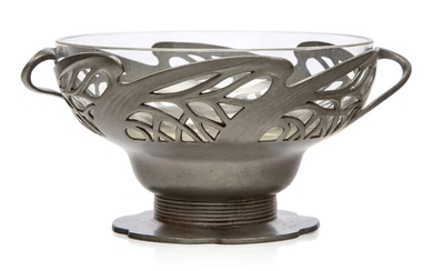 Orivit (German), an Art Nouveau pewter twin-handled bowl with original glass liner, Stamped 'Orivit 2325', The pierced pewter with twin sinuous handles raised on a short ribbed stem and shaped foot and having the original external patina, original...