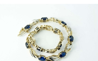 Oval Sapphire And Diamond Gold Tennis Bracelet The bracelet...