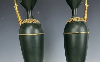 PAIR OF PATINATED AND GILT BRONZE EWERS