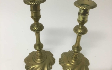 Pair of George I / II wrythen brass candlesticks