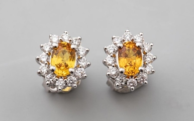 Pair of oval earrings in 18k white gold...