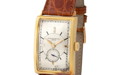 Patek Philippe. Well Preserved and Elegant Rectangular-shape Curved Wristwatch in Yellow Gold, With Silver Sector Dial and Extract from Archives