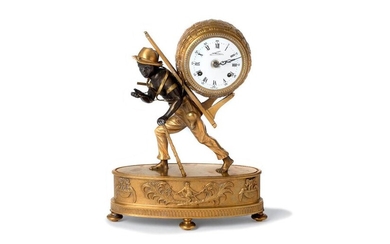 Pendule «au portefaix» figurant un porteur de coton en bronze doré et patiné, Ba