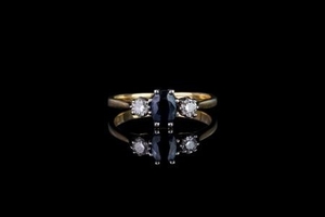 Sapphire and diamond ring, 1 sapphire in the centre, 8 claw set, 2 diamonds set either side, 18ct yellow gold band, ...