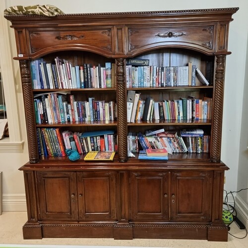 Star Lot : A very large mahogany double sized bookcase. With...