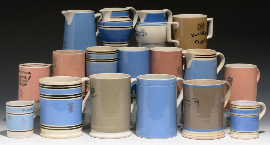 TWELVE CYLINDRICAL SLIP-DIPPED MUGS, MID 19TH-EARLY 20TH C q...