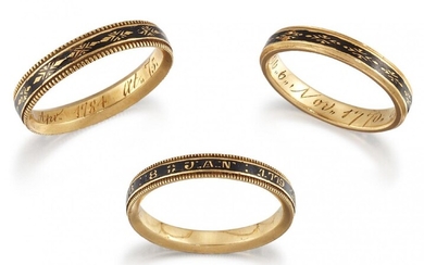 Three George III gold and black enamel mourning rings, comprising:...
