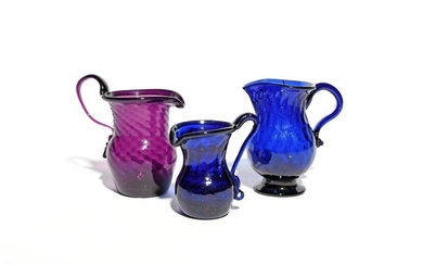 Three coloured glass cream jugs c.1780-1800, one amethyst and spiral-moulded...