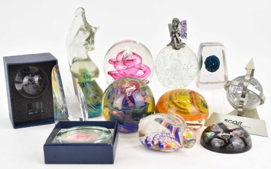 Twelve glass, acrylic and other paperweights to include a Mdina...