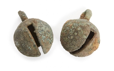 Two Chinese bronze animal bells, Neolithic period, each of spherical...