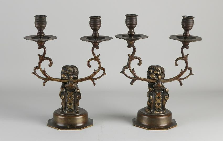 Two antique Dutch bronze candlesticks with lion and