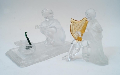 Two modern St Louis glass sculptures, comprising: the snake charmer and a harp player, the crouching snake charmer and basket signed Saint Louis, lacking pungi, the snake charmer - 17cm wide, 12cm high, the harp player - 12cm high (2)