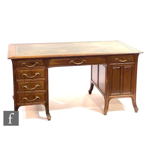 Unknown - A French Art Nouveau walnut desk with inset leathe...