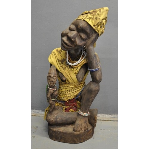 West African carved wooden mother and child figure with text...