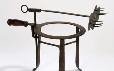 18th Century iron lark spit/trivet, on a swing pole above the trivet with turned handle, 38cm long