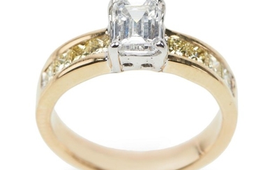 A DIAMOND RING - Featuring an emerald cut diamond weighing 1.306cts, shouldered by princess cut yellow diamonds totalling 1.20cts, i...