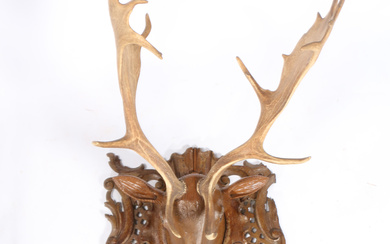3410567. A LATE 19TH/EARLY 20TH CENTURY CARVED STAG HEAD WITH ANTLERS.