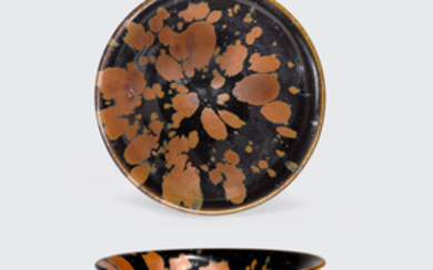 A black glazed conical bowl with russet 'partridge-feather' markings