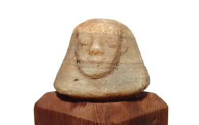 An Egyptian alabaster head canopic from a canopic jar