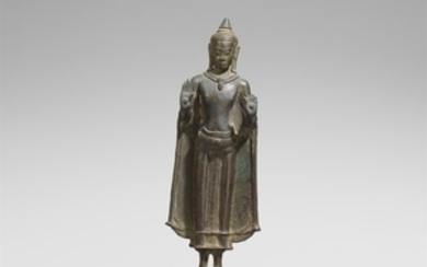 A Northeastern Thai bronze figure of Buddha. ...