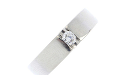 A platinum and diamond single-stone band ring.