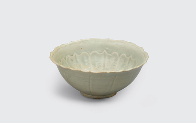 A celadon bowl with impressed decoration