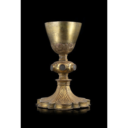 A 16th-century Tuscan gilded copper chalice (h. cm 22) (defects)