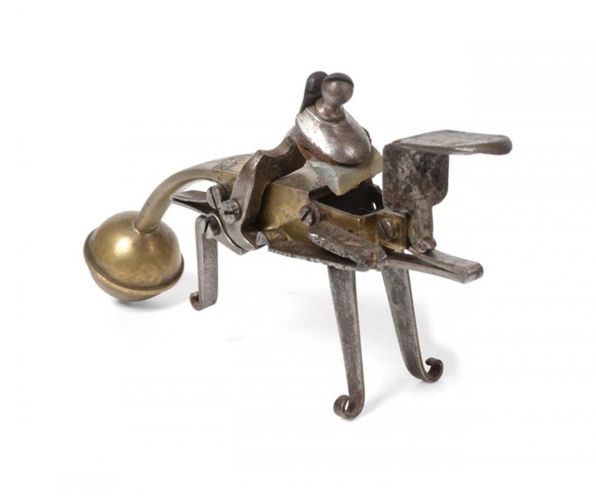 A 17th Century Continental Brass Flintlock Tinder Lighter, the left...
