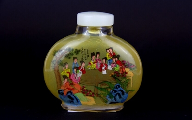 A 1960's Chinese inside painted snuff bottle of court ladies in a garden with extensive calligraphy on the reverse, H. 8cm.