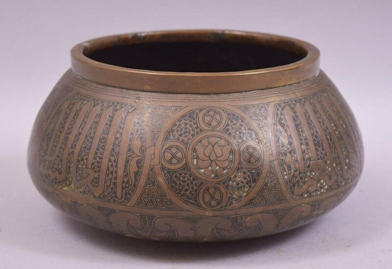 A 19TH CENTURY PERSIAN BRASS BOWL, the exterior with