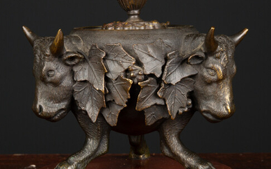 A 19th century circular bronze ink stand