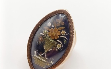 A 19th century gold and blue enamel mourning ring, decorated...