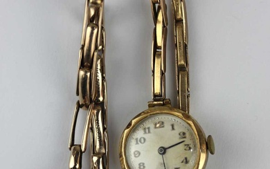 A 9ct gold circular cased lady's wristwatch