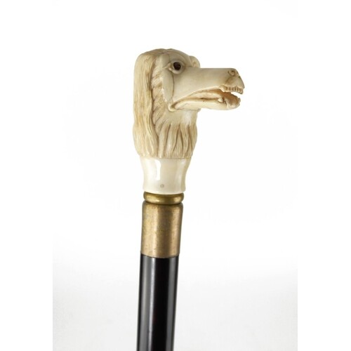 A CARVED BONE HANDLED WALKING STICK Hunting dog with pronoun...