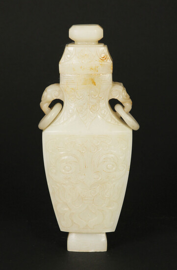 A CHINESE WHITE JADE VASE WITH COVER