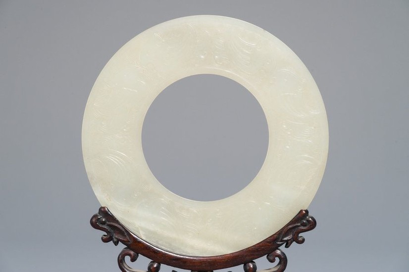 A Chinese pale celadon jade bi disc, Ming...