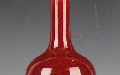 A Chinese sang-de-boeuf glazed bottle vase, 19th/20th century, covered in a streaky oxblood glaze, h