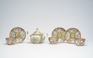 A Chinese seven-piece Canton famille rose tea service with palace scenes and floral design