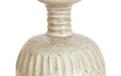 A Chinese stoneware celadon-glazed fluted vase, Song dynasty, on short foot rising to a globular body with two bands of continuous pinched petal decorations, supporting a ribbed neck beneath a cup-shaped mouth, covered in an allover celadon glaze...