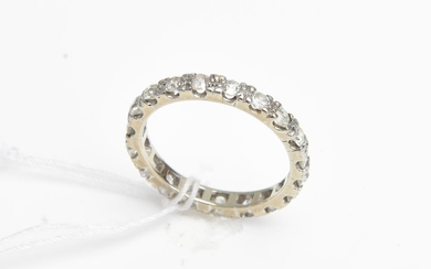 A DIAMOND ETERNITY RING-The full circle ring set with old European and round brilliant cut diamonds totalling 1.35cts in 18ct white...