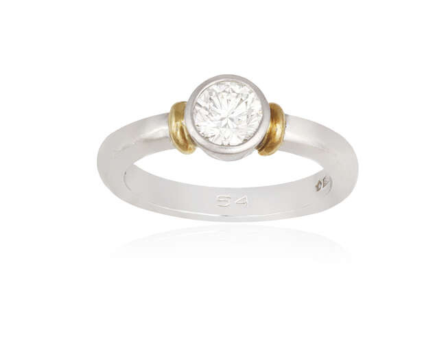 A DIAMOND SINGLE-STONE RING The collet-set brilliant-cut diamond...