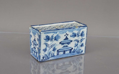 A Delft style blue and white pottery flower brick