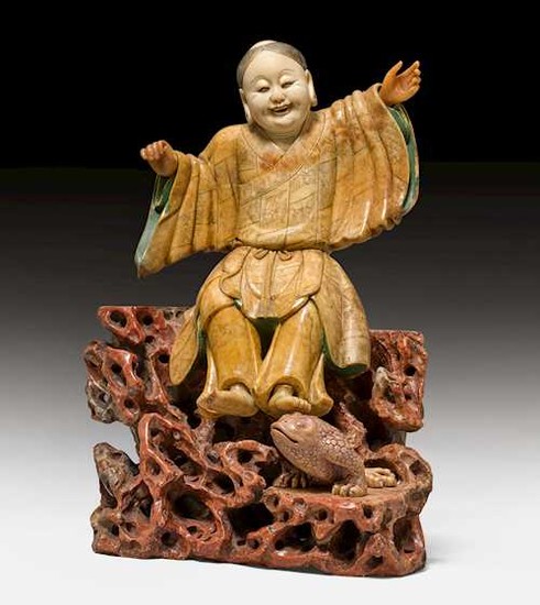A FINELY CARVED SOAPSTONE FIGURE OF LIU HAI AND HIS TOAD.