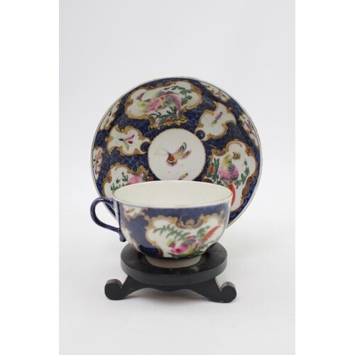 A First period Worcester cup and saucer with blue scale grou...