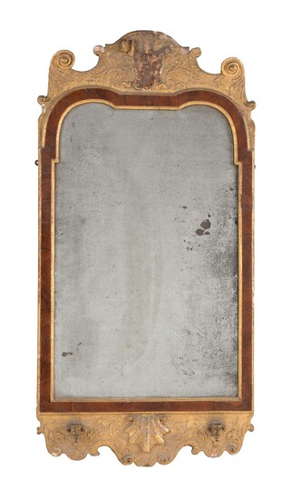 A George I gilt gesso, walnut and parcel gilt wall mirror