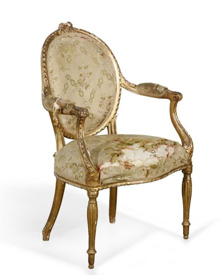 A George III carved giltwood armchair