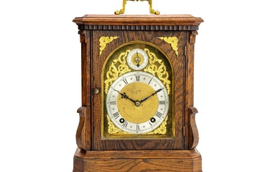 A German Winterhalder and Hofmeier oak cased chiming bracket clock.