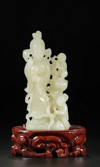 A HETIAN JADE CARVED LADY WITH KIDS ORNAMENT